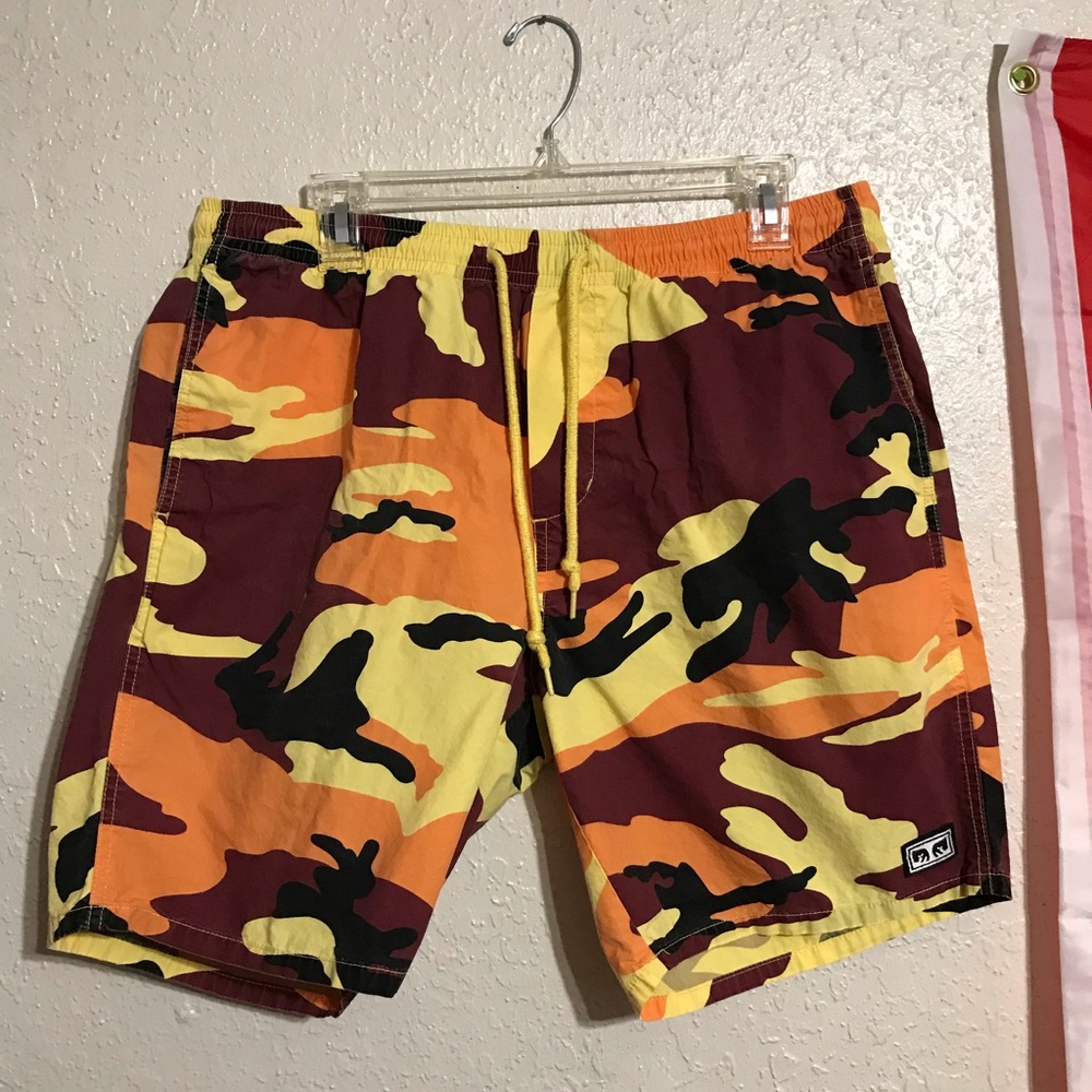 red, orange, yellow, black “obey” camo shorts